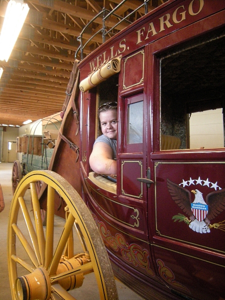 M posing in the Concord coach